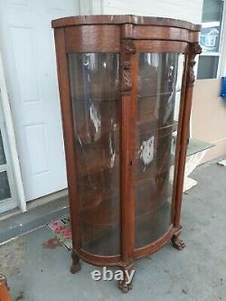 Antique Victorian tiger Oak China Cabinet Curio with Lion Heads and claw Feet