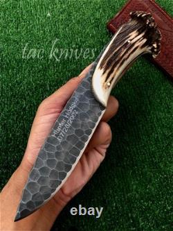 Couteau de chasse extérieur avec poignée en bois de cerf texturé pierre.